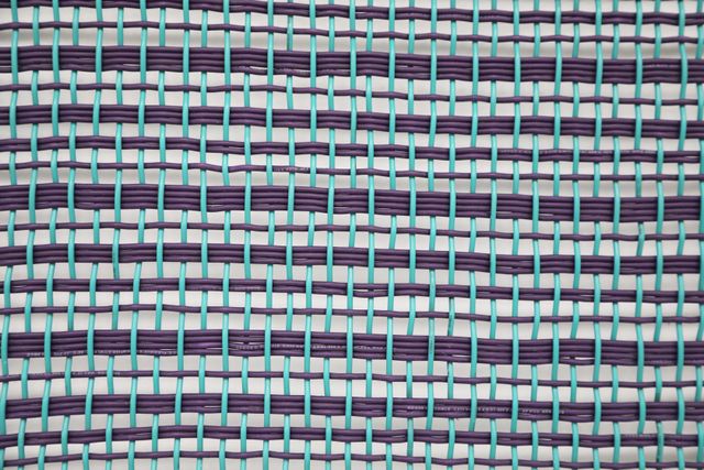 Image of artwork titled "Redes de conversión: Plain weave with numerically different groups of wefts(green and purple)" by Ximena Garrido-Lecca