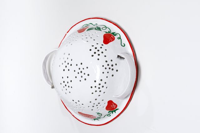 Image of artwork titled "Colander with eyelash and drill bit" by Tamara Johnson