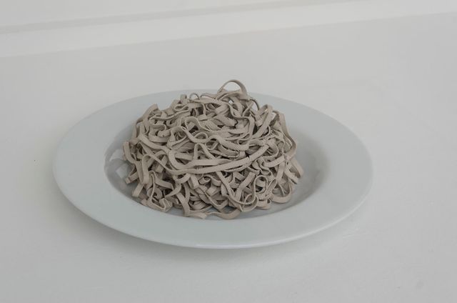 Jennifer Teets and Lorenzo Cirrincione, <em>Dirty pasta</em>, 2018. Raw earth pasta, serving plate. Variable dimensions.
