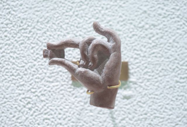 Image of artwork titled "Street Amulet -hand and USB flash drive-" by Hiroko Kubo