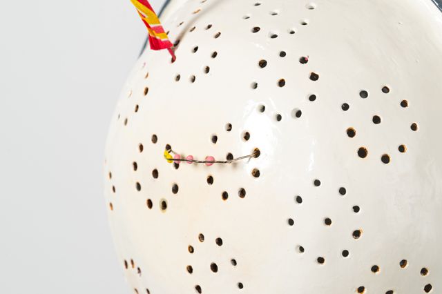 Image of artwork titled "Colander with sparkler and fake braces" by Tamara Johnson