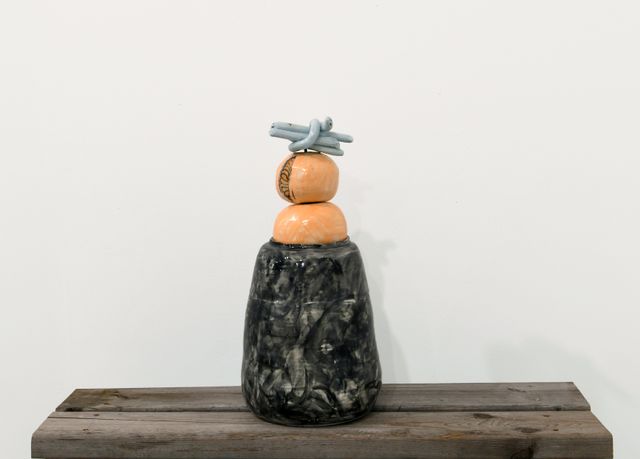 Image of artwork titled "Black jar stoppered with unwhole oranges and mother and baby snakes" by Johanna Jackson